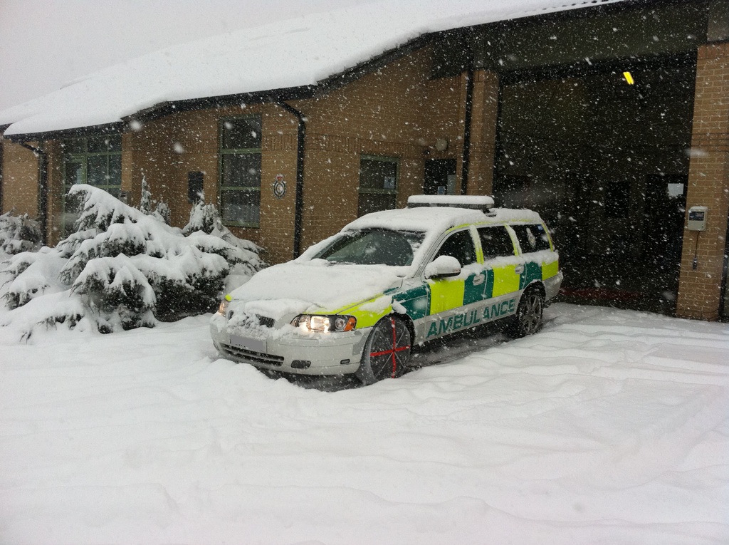 autosock fitted to ambulancecar in snow