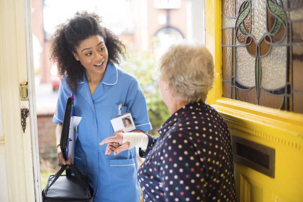 carer visiting home istock_000064417187_full