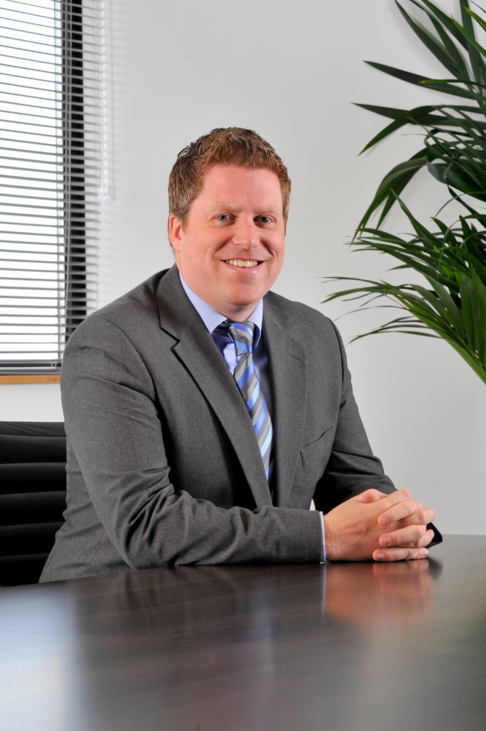 photo simon alderson formal at desk mid res