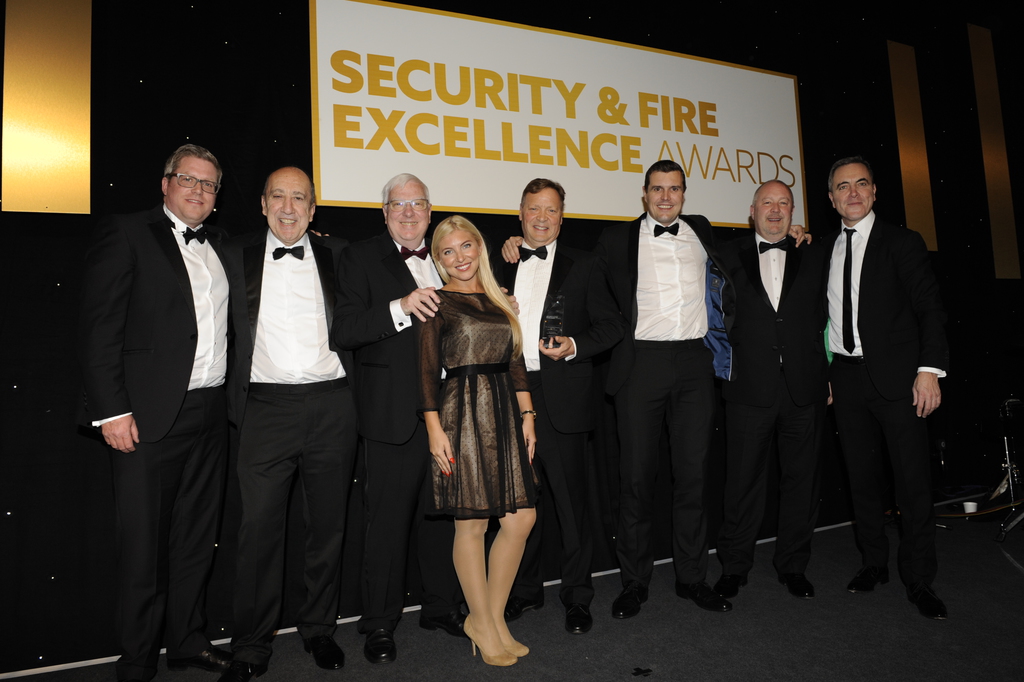 axis security team picking up 2018 security guarding company of the year award