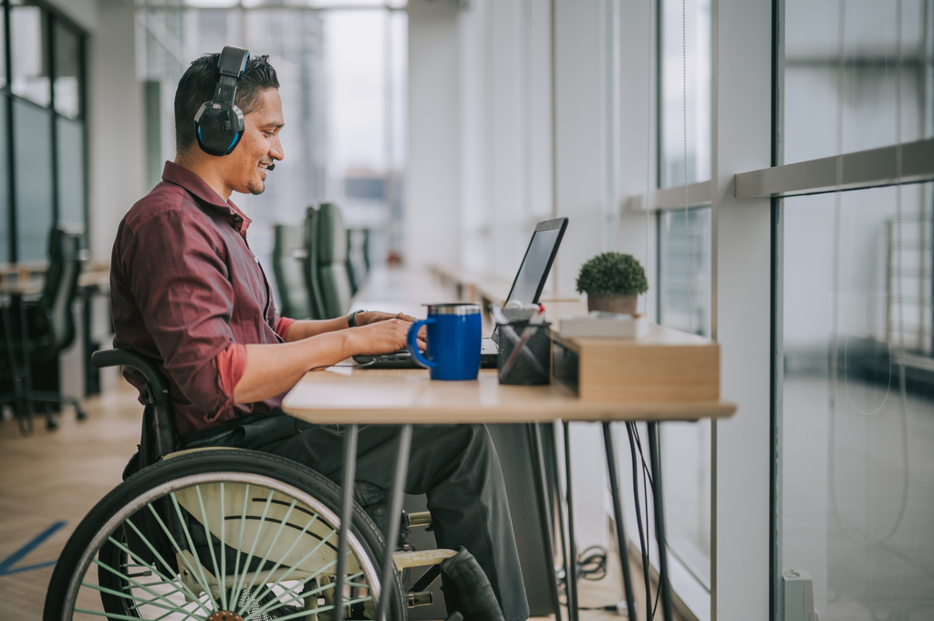 iStock-Wheelchair-office-disability-video-call-1319810505