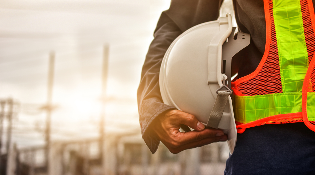 iStock-hold-hardhat-sunset-1314259386.jpg
